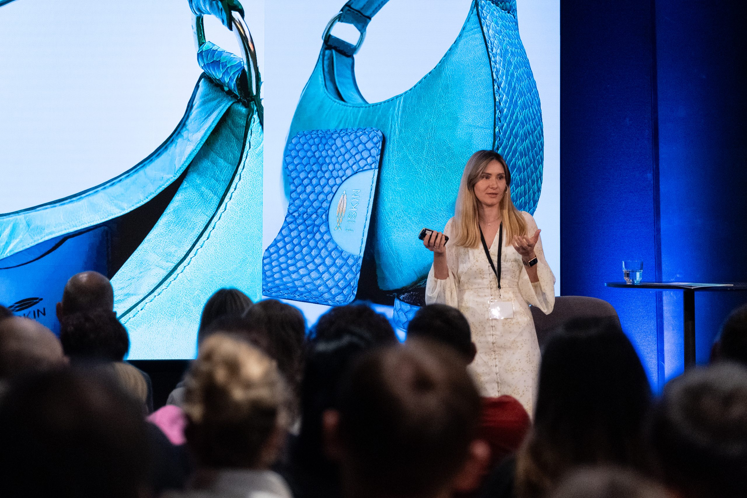 Yuliia presenting Fiskin on stage in Norway