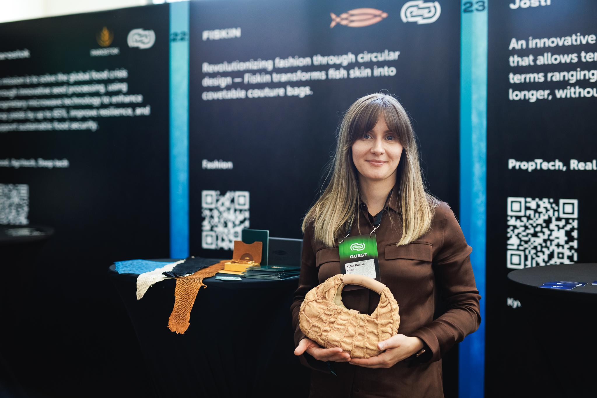 Yuliia Buhlak holding a Fiskin bag after returning the business to Ukraine